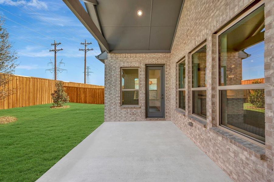 Exterior details and patio area of a home in Kreymer at the Park, Wylie (Image 21).