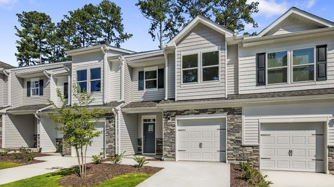 Front exterior of a new home in Chapel Townes, Raleigh, NC, highlighting curb appeal (Image 2). Front exterior of a new home in Chapel Townes, Raleigh, NC, highlighting curb appeal (Image 2).