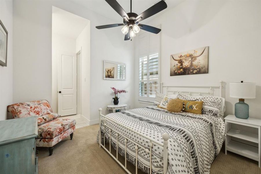Bedroom featuring carpet flooring and a ceiling fan