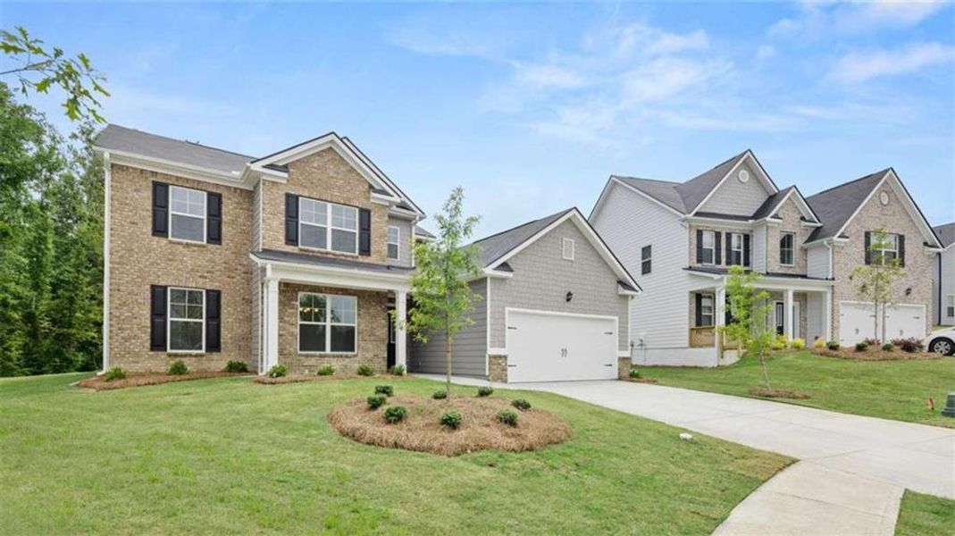 Front exterior of a new home in Water Oak Estates, Lawrenceville, GA, highlighting curb appeal (Image 1). Front exterior of a new home in Water Oak Estates, Lawrenceville, GA, highlighting curb appeal (Image 1).