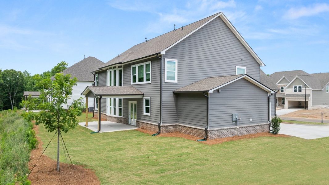 Representative exterior photo of a completed home built from the Edinburgh by D.R. Horton in Thalley Creek Estates, Cumming, GA (Image 19).