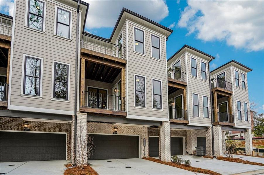 Front exterior of a new home in Byers Park, Alpharetta, GA, highlighting curb appeal (Image 2). Front exterior of a new home in Byers Park, Alpharetta, GA, highlighting curb appeal (Image 2).