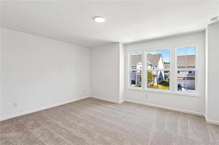 Spacious, unfurnished interior of a new home in Eastlyn Crossing, Flowery Branch (Image 26).