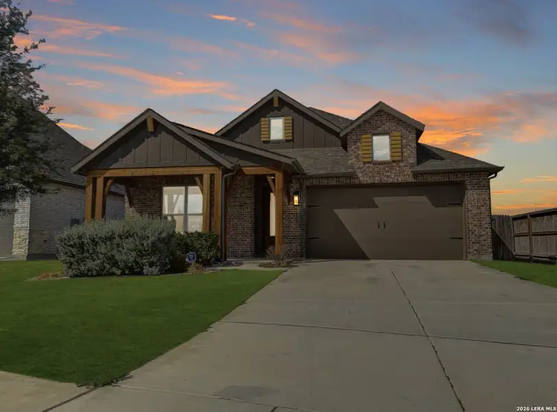 Front exterior of a new home in Alsatian Oaks, Castroville, TX, highlighting curb appeal (Image 1). Front exterior of a new home in Alsatian Oaks, Castroville, TX, highlighting curb appeal (Image 1).