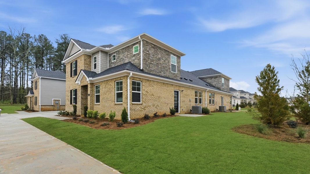 Front exterior of a new home in Independence Villas and Townhomes, Loganville, GA, highlighting curb appeal (Image 2).