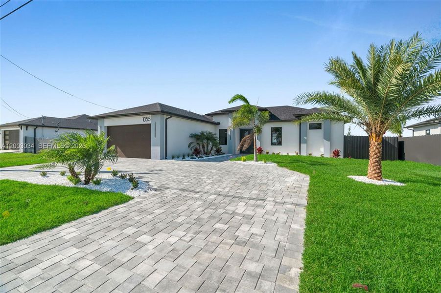 Front exterior of a new home in , Cape Coral, FL, highlighting curb appeal (Image 25).