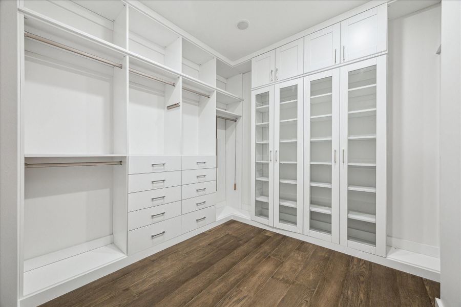Custom designed primary closet with highly functional and convenient shelving. Custom designed primary closet with highly functional and convenient shelving.