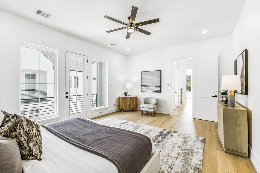 From this angle, the suite’s generous proportions and seamless flow to the spa-inspired ensuite are on full display. Oversized windows flood the space with natural light, highlighting the architectural symmetry and designer-grade finishes. Whether you’re unwinding after a long day or enjoying a slow weekend morning, this room balances refined luxury with livable warmth.