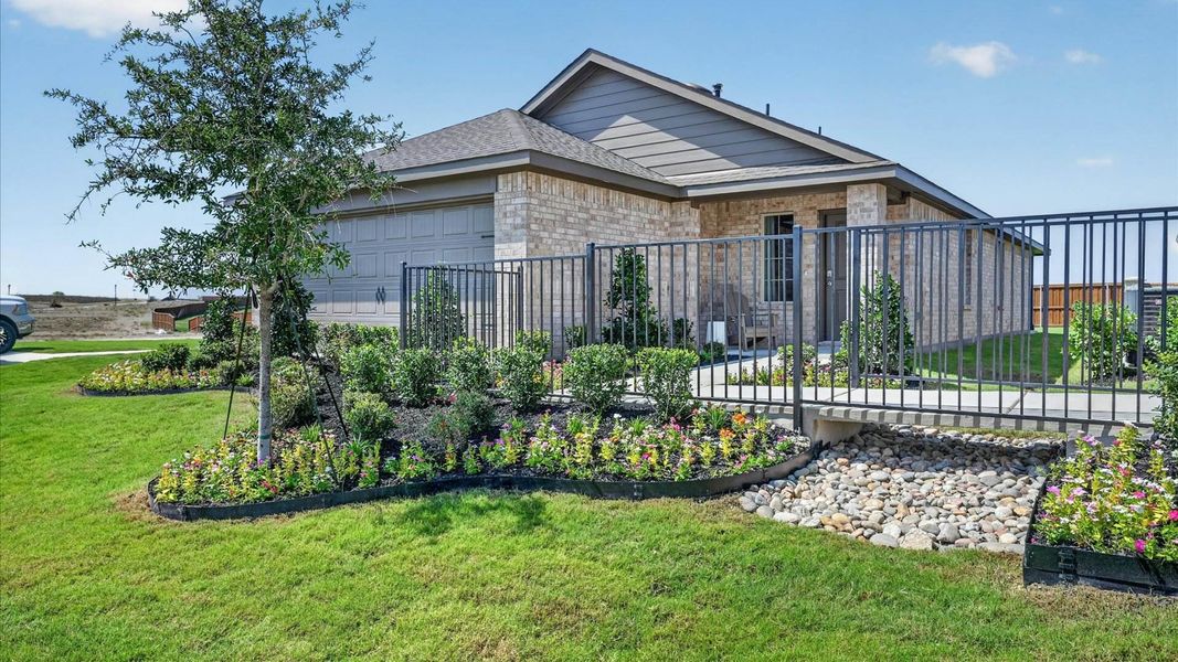Representative exterior photo of a completed home built from the Amber by D.R. Horton in The Hills at Reunion, Newark, TX (Image 21).