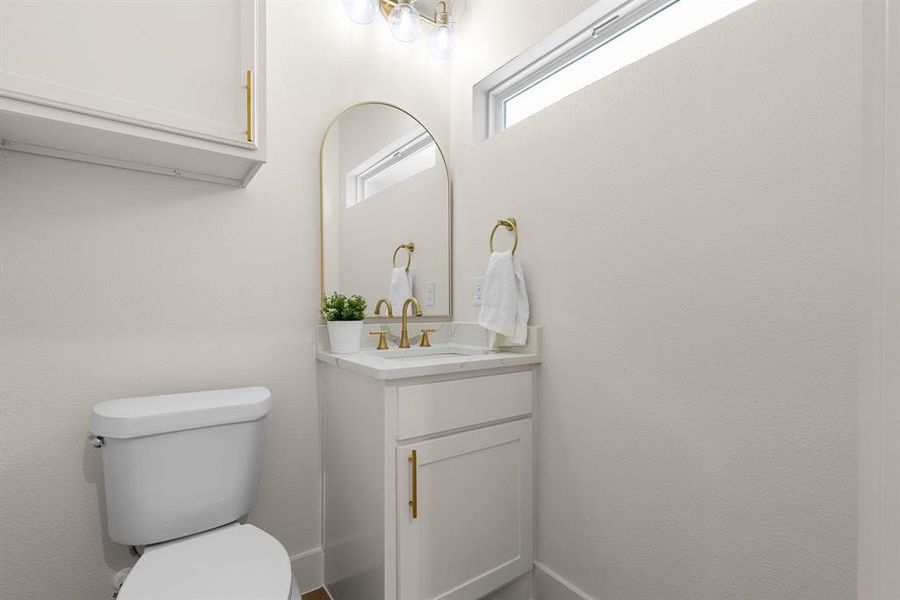 Bathroom featuring vanity and toilet