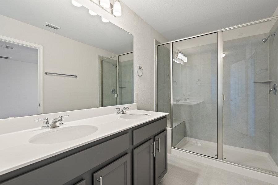 Photos are of a completed model of the same floor plan and are for illustrative purposes only. Actual home is under construction and design selections, materials, and features may differ. Confirm final specifications with the New Home Consultant.