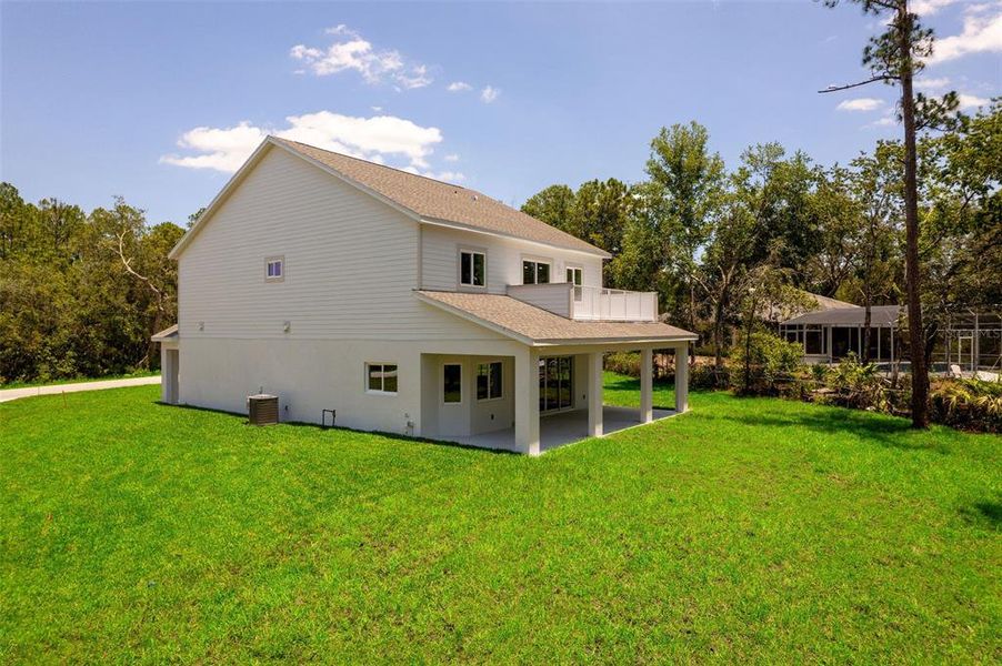 Front exterior of a new home in , Deltona, FL, highlighting curb appeal (Image 26).