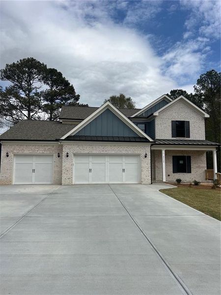 Front exterior of a new home in , Loganville, GA, highlighting curb appeal (Image 22).