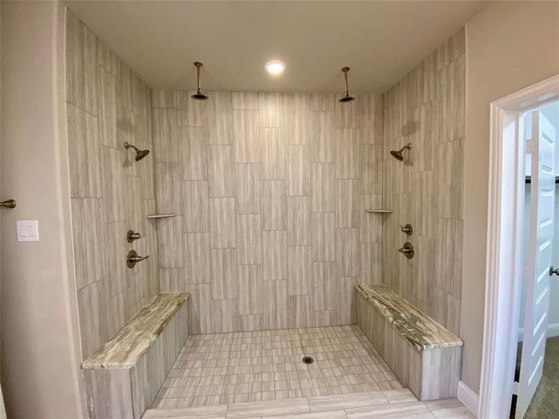 HUGE master bedroom with shower 4 shower heads, 2 Quartz benches(not in photo,) oversized tile, dropped tile mud pan, and frameless glass (not yet installed.)