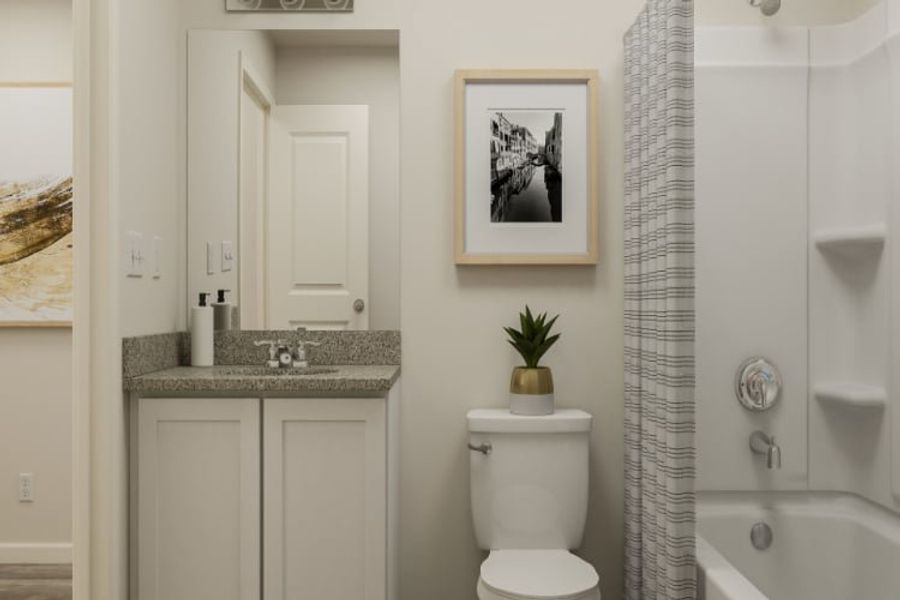 A bathroom with a toilet and sink.