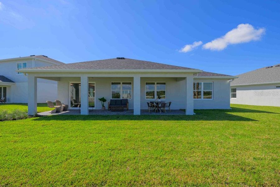 Exterior details and patio area of a home in Brystol North at Wylder, Port St. Lucie (Image 3).