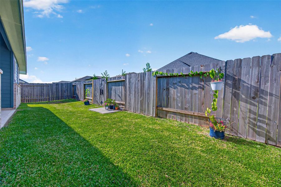 This property boasts a beautifully maintained and highly functional backyard, specifically designed to offer a perfect balance of privacy, security, and effortless living. The fully enclosed backyard provides a secluded sanctuary that is ideal for homeowners who desire a low-maintenance outdoor environment without sacrificing aesthetic appeal or utility. Key Backyard Features:*   Fully fenced perimeter: The entire backyard is securely enclosed, offering enhanced privacy and a safe, protected environme
