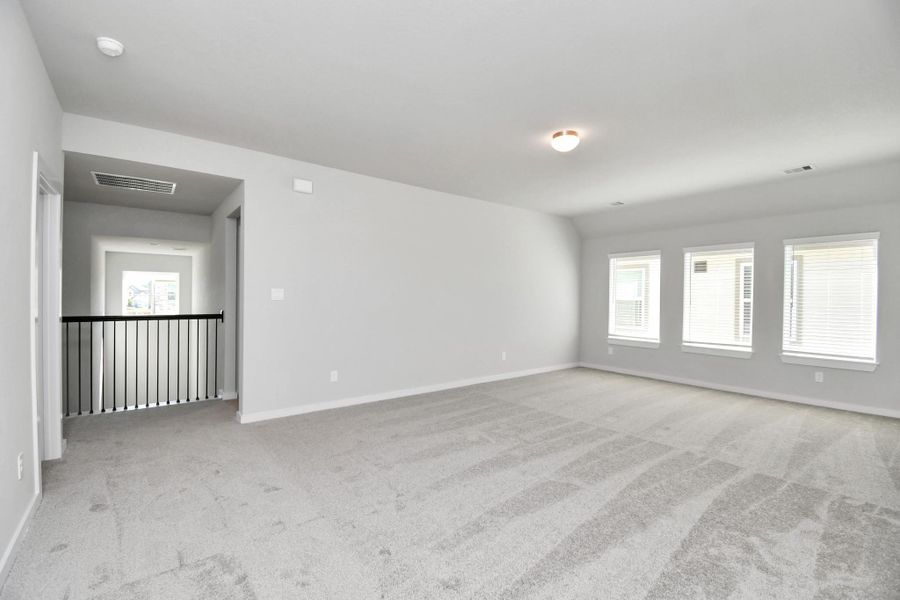 Discover a haven of leisure in this fantastic game room! Whether. Sample photo of completed home with similar floor plan. Actual colors and selections may vary.