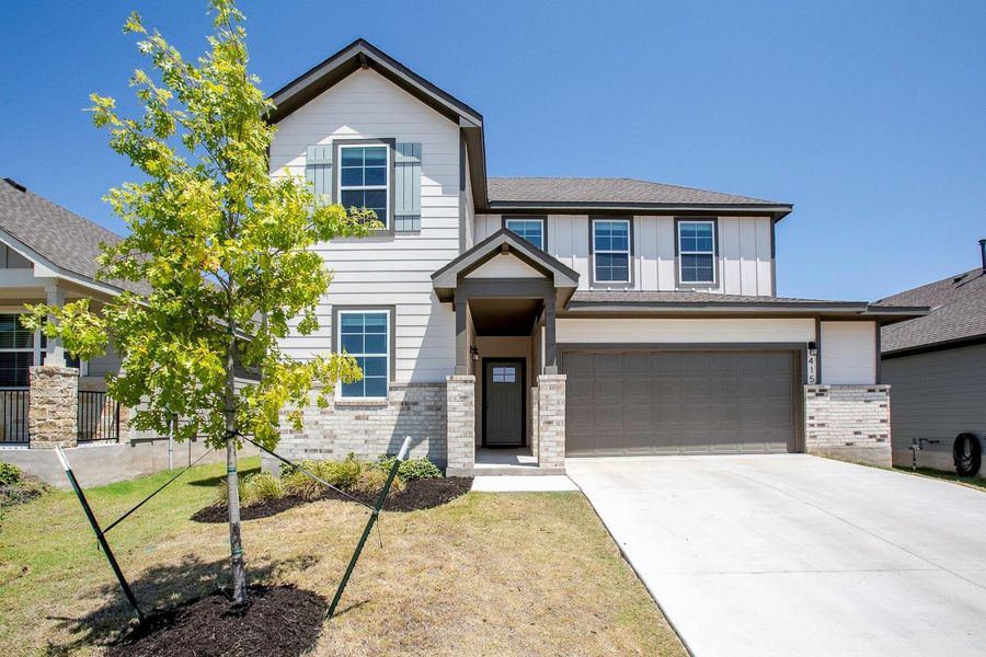 Front exterior of a new home in Brooks Ranch, Kyle, TX, highlighting curb appeal (Image 23).