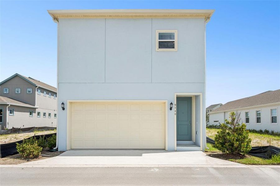 Front exterior of a new home in Laureate Park, Orlando, FL, highlighting curb appeal (Image 32).