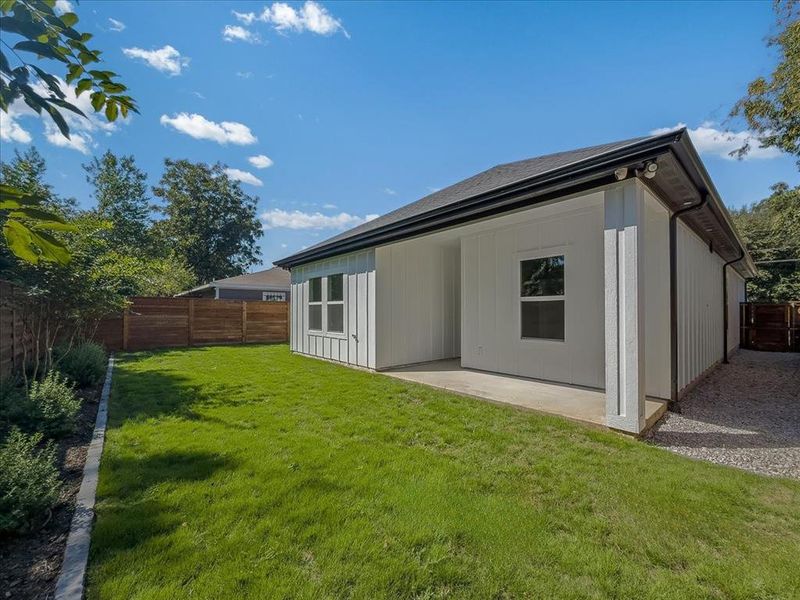 Rear view of property with a fenced backyard and a patio area Rear view of property with a fenced backyard and a patio area
