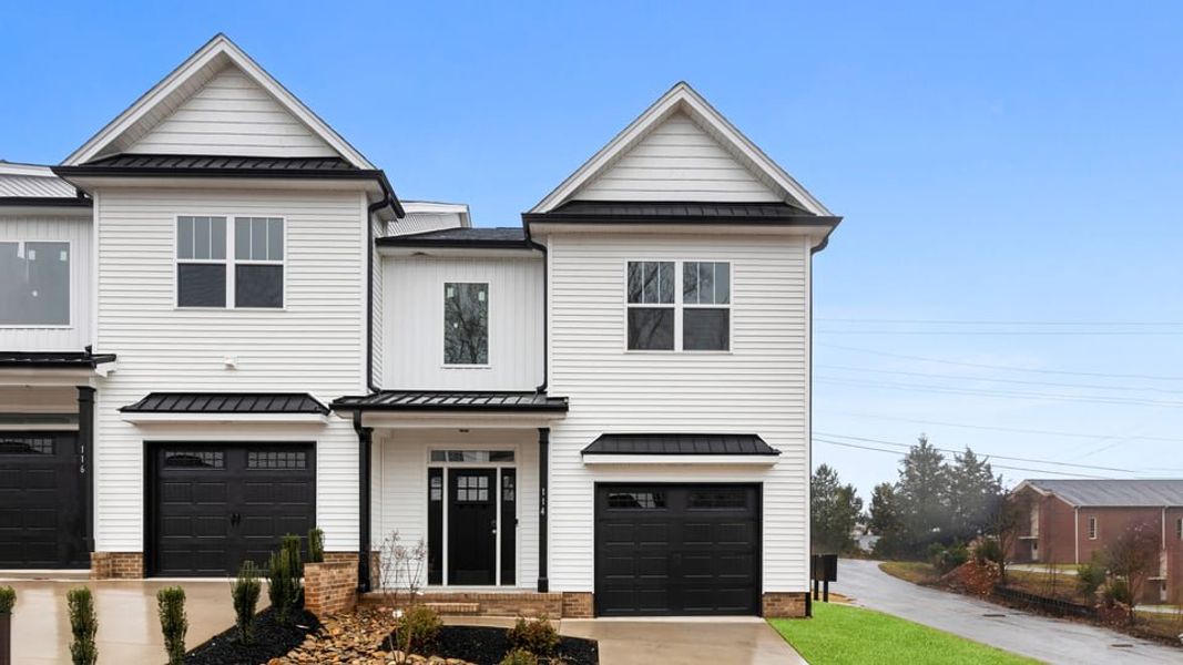 Front exterior of a new home in Pearson Road Townhomes, Easley, SC, highlighting curb appeal (Image 1). Front exterior of a new home in Pearson Road Townhomes, Easley, SC, highlighting curb appeal (Image 1).