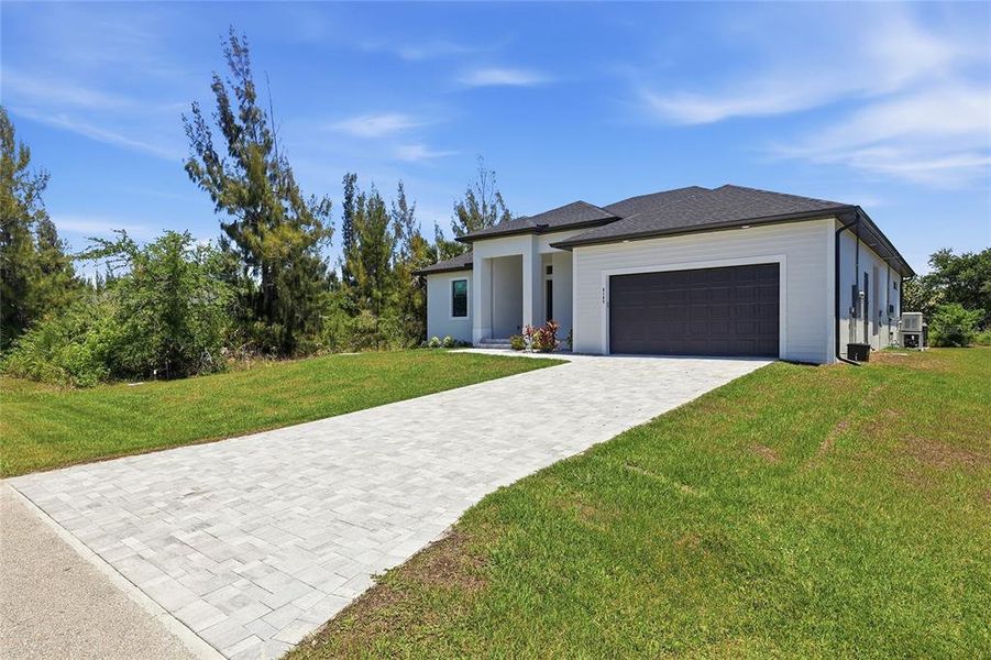 Front exterior of a new home in , Port Charlotte, FL, highlighting curb appeal (Image 22).
