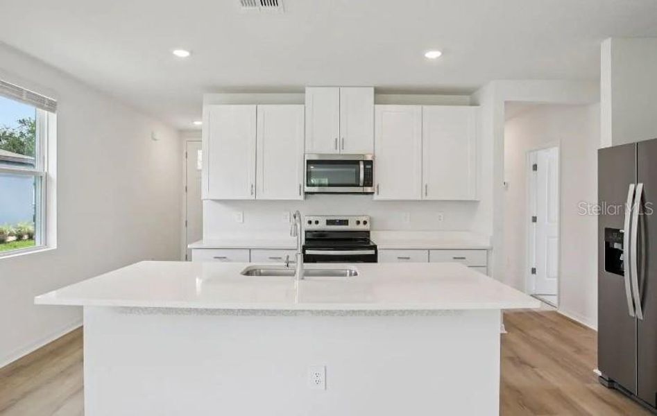 Furnished interior view inside a new home in Magnolia Bay - Premier Series, Nokomis (Image 4). Furnished interior view inside a new home in Magnolia Bay - Premier Series, Nokomis (Image 4).