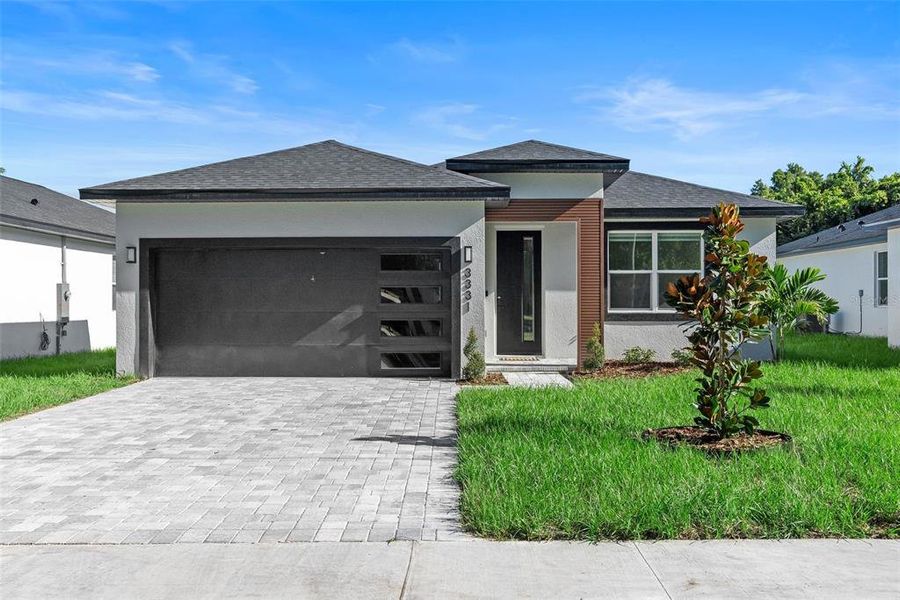 Front exterior of a new home in , Orlando, FL, highlighting curb appeal (Image 18).