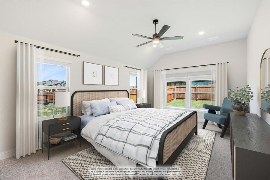 Bedroom with vaulted ceiling, ceiling fan, large windows, and carpeted floor with a rattan-frame bed and neutral decor Bedroom with vaulted ceiling, ceiling fan, large windows, and carpeted floor with a rattan-frame bed and neutral decor