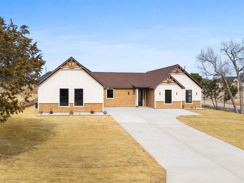 Front exterior of a new home in , Granbury, TX, highlighting curb appeal (Image 2). Front exterior of a new home in , Granbury, TX, highlighting curb appeal (Image 2).