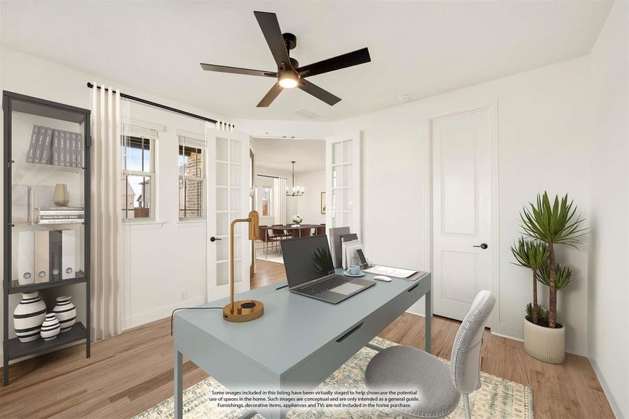 Home office with blue desk, ceiling fan, hardwood floors, and French doors opening to dining area