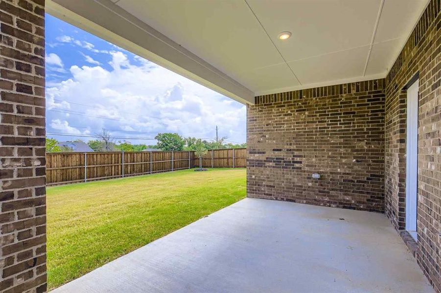 Exterior details and patio area of a home in Prestige Collection at Overland Grove, Forney (Image 15). Exterior details and patio area of a home in Prestige Collection at Overland Grove, Forney (Image 15).