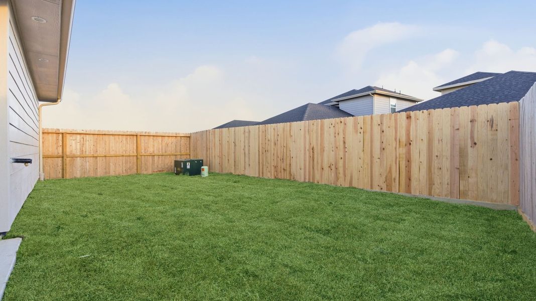 Exterior details and patio area of a home in Lakes at Westland Ranch, League City (Image 4).