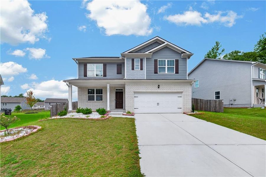 Front exterior of a new home in Glen at Kensington, Lithia Springs, GA, highlighting curb appeal (Image 26). Front exterior of a new home in Glen at Kensington, Lithia Springs, GA, highlighting curb appeal (Image 26).