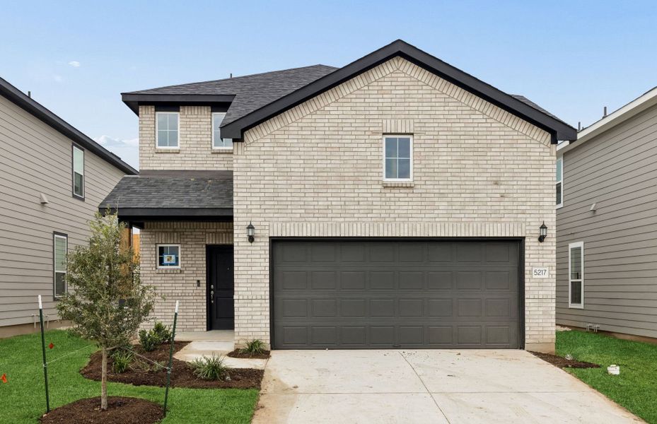 Front exterior of a new home in Cameron Place, Austin, TX, highlighting curb appeal (Image 18). Front exterior of a new home in Cameron Place, Austin, TX, highlighting curb appeal (Image 18).