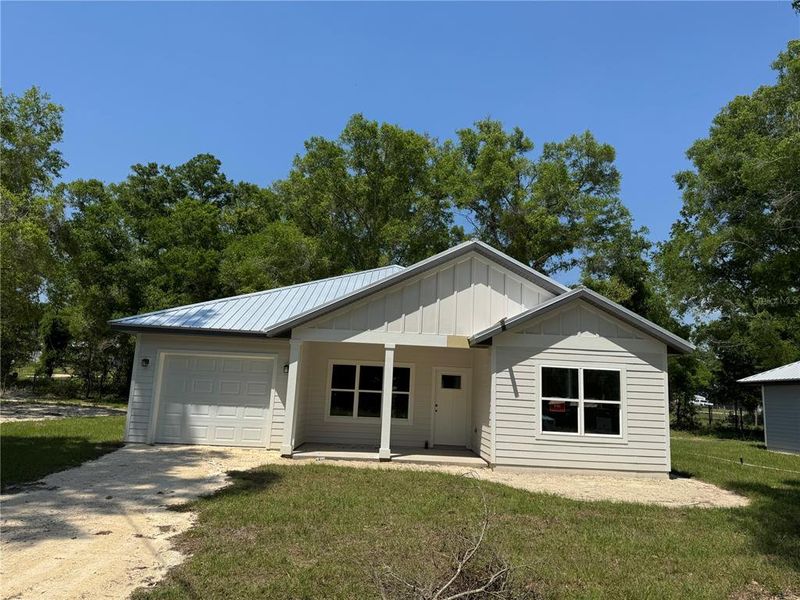 Front exterior of a new home in , Trenton, FL, highlighting curb appeal (Image 20).