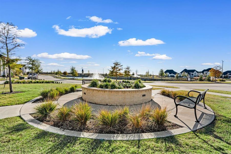 View of property's community with a yard and a residential view