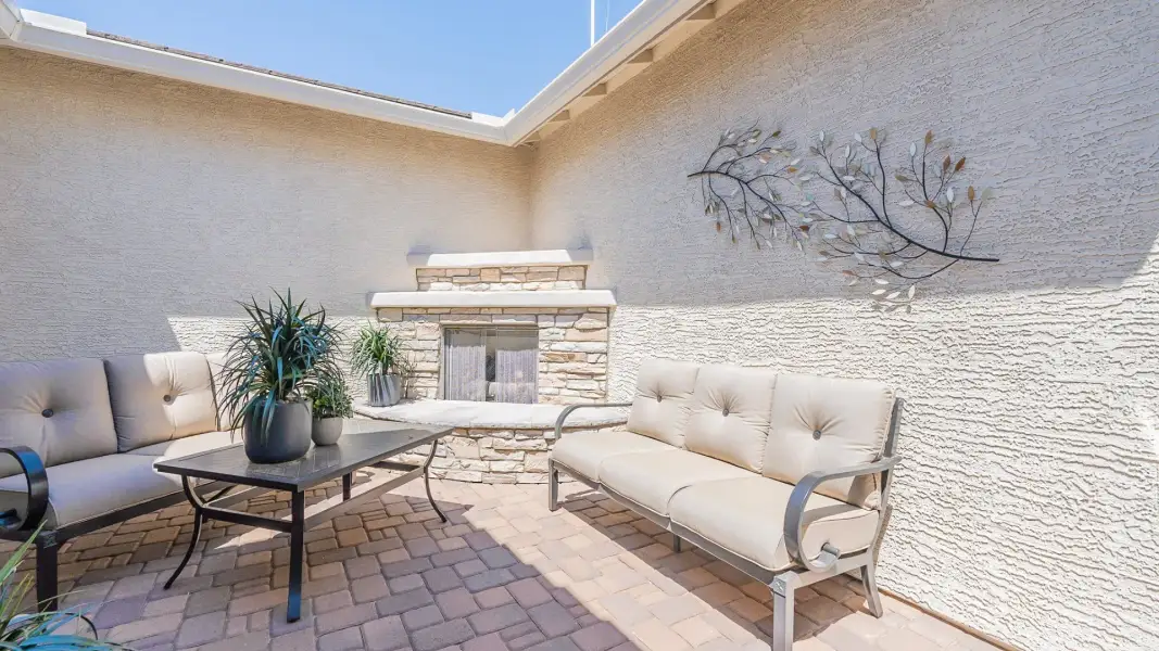 Exterior details and patio area of a home in Windrose, Waddell (Image 20).