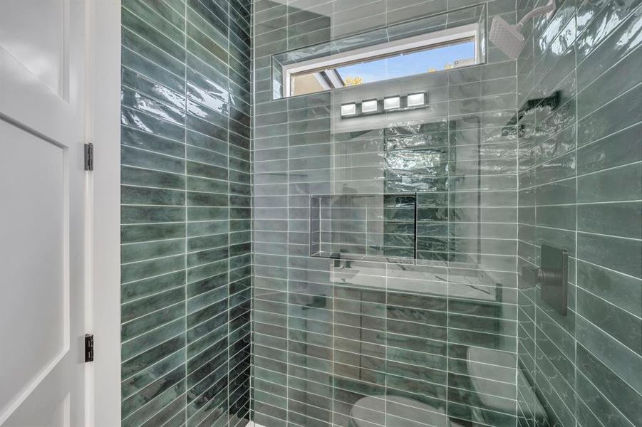 Bathroom with a tile shower