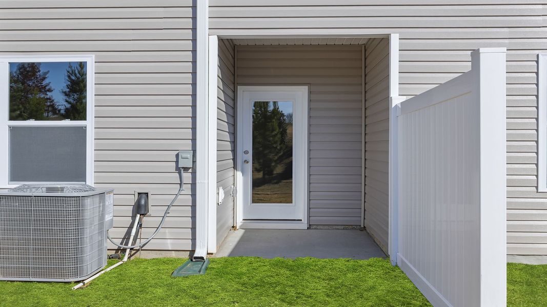 Exterior details and patio area of a home in Brookside Ridge Townhomes, Greer (Image 4).