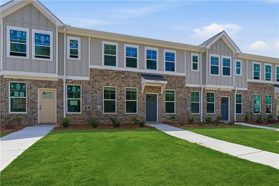 Front exterior of a new home in Avery Landing, McDonough, GA, highlighting curb appeal (Image 17).