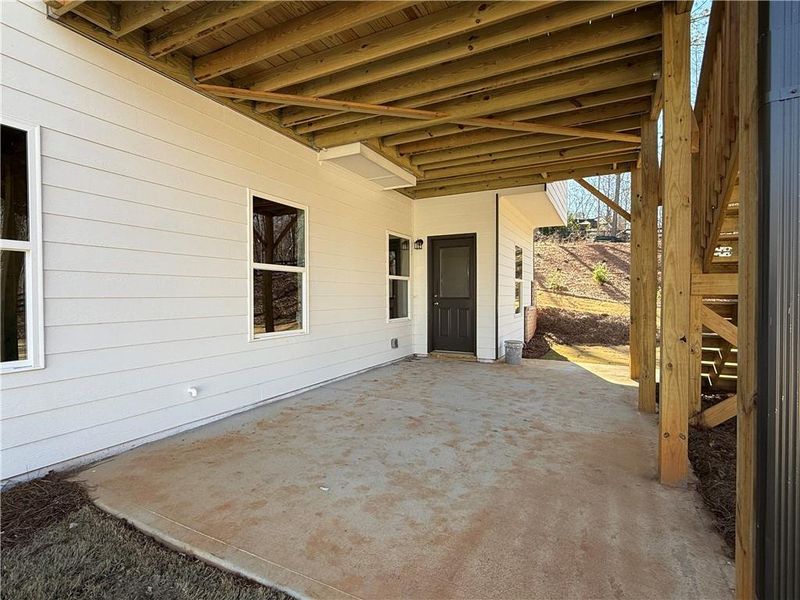 Exterior details and patio area of a home in River Rock, Ball Ground (Image 4).
