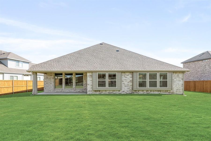 Front exterior of a new home in Rockwood 90, Mansfield, TX, highlighting curb appeal (Image 26). Front exterior of a new home in Rockwood 90, Mansfield, TX, highlighting curb appeal (Image 26).