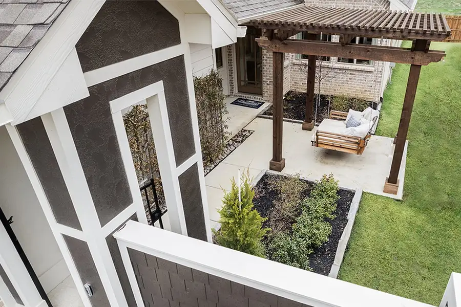 Exterior details and patio area of a home in Keeneland, Aubrey (Image 3).