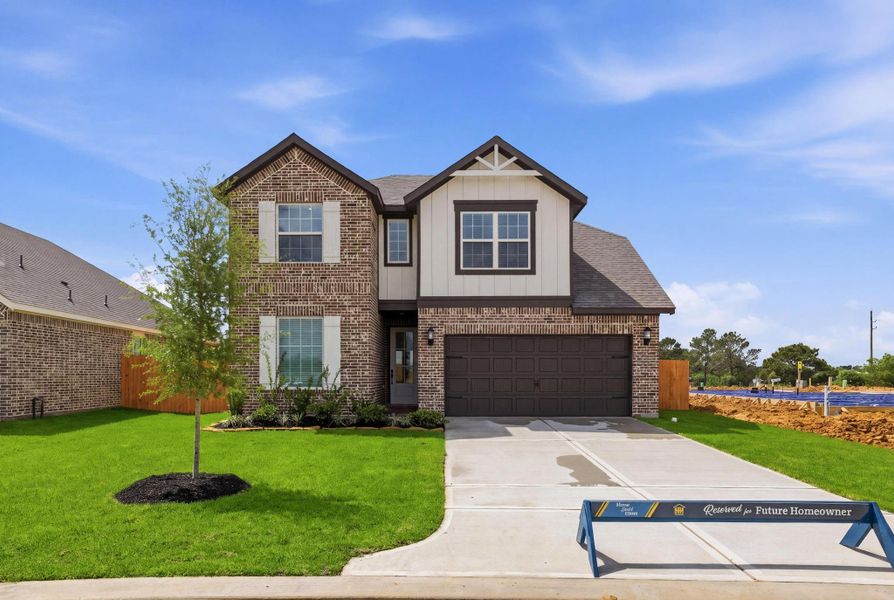Front exterior of a new home in Sweetwater Ridge, Conroe, TX, highlighting curb appeal (Image 1). Front exterior of a new home in Sweetwater Ridge, Conroe, TX, highlighting curb appeal (Image 1).