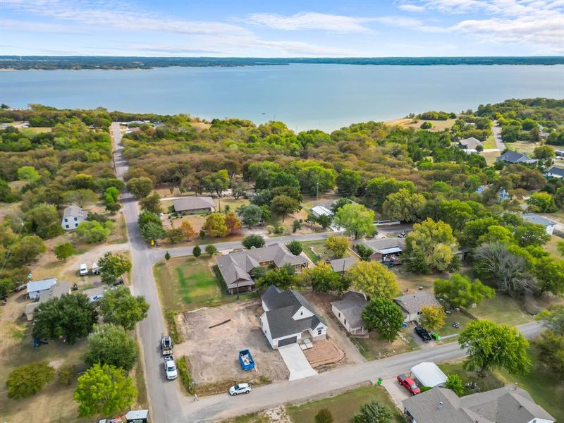 Aerial perspective of suburban area with a nearby body of water