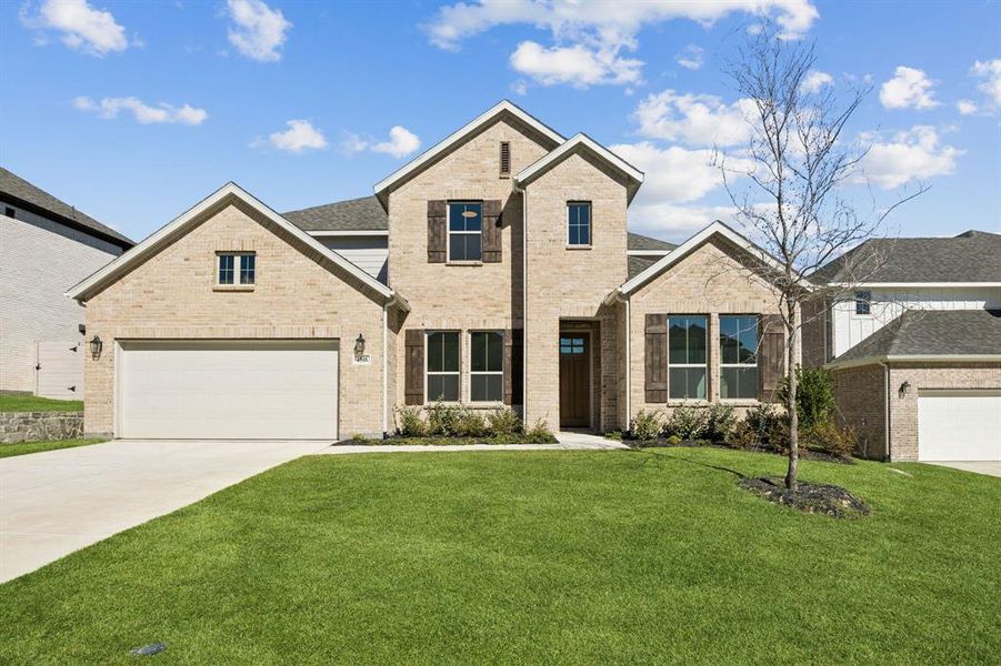 Front exterior of a new home in Painted Tree Lakeside, McKinney, TX, highlighting curb appeal (Image 1). Front exterior of a new home in Painted Tree Lakeside, McKinney, TX, highlighting curb appeal (Image 1).