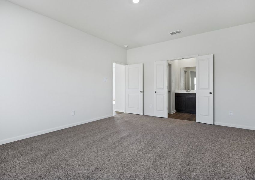 The master suite has a large bedroom, ensuite bathroom and a walk-in closet.