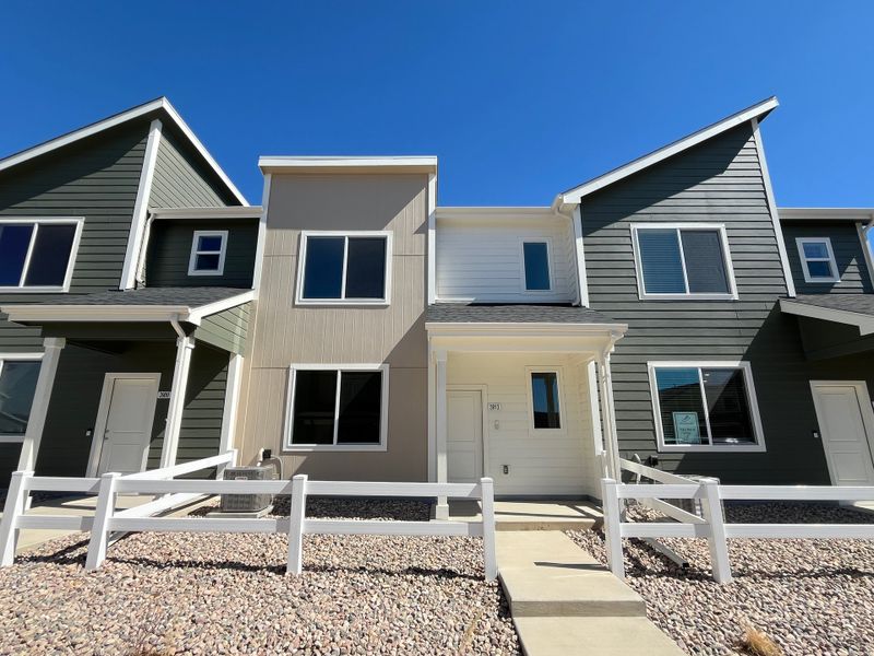 Front exterior of a new home in Liberty Draw, Evans, CO, highlighting curb appeal (Image 25). Front exterior of a new home in Liberty Draw, Evans, CO, highlighting curb appeal (Image 25).